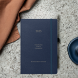 Velite Armor Premium Notebook in dark blue with teal elastic band, perfect for stylish and efficient 2025 planning.