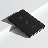 Black Velite Armor Premium Notebook with embossed branding and dual ribbon markers, designed for premium organization in 2025.