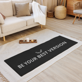 A black Velite Armor yoga mat spread out in a stylish living room, featuring soft lighting and elegant decor for a peaceful workout atmosphere.