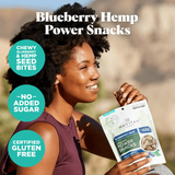 Woman enjoying Navitas Organics Power Snacks Blueberry Hemp – plant-based energy for active lifestyles

