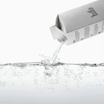 Boxed Water 500 ml – Pure & Sustainable Carton Packaging pouring purified water into clear liquid, showcasing freshness and eco-conscious design.