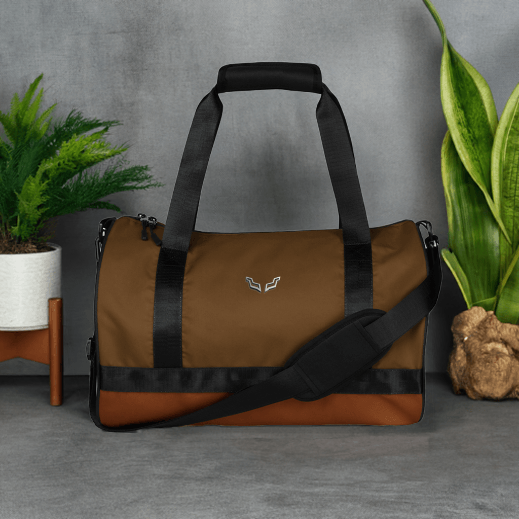 Velite Armor Gym Bag in brown with black straps, featuring a sleek, water-resistant design ideal for fitness and travel use.