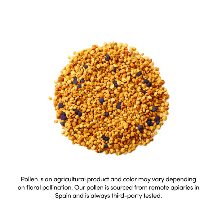 Close-up of granulated bee pollen with golden and dark colors, highlighting its natural origin.