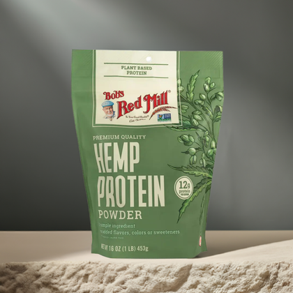 Bob's Red Mill Hemp Protein Powder 16 oz pouch with 12g plant-based protein, ideal for smoothies and baking, shown in sports nutrition setting.