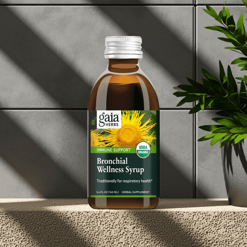 Gaia Herbs Bronchial Wellness Syrup displayed with soft natural lighting and plant shadows

