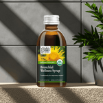 Gaia Herbs Bronchial Wellness Syrup displayed with soft natural lighting and plant shadows

