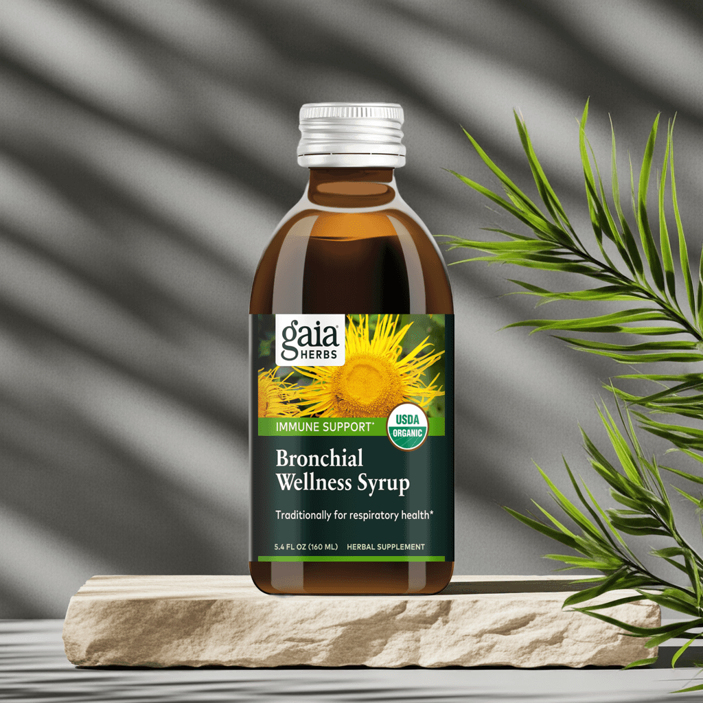 Organic Bronchial Herbal Syrup bottle next to green plant, highlighting natural formula


