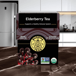 Elderberry Tea organic herbal supplement for immune support, displayed on kitchen counter with fresh elderberries


