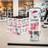 Celsius Sparkling Peach Vibe energy drink 12-pack displayed in a gym setting. Zero sugar, healthy peach flavor with essential vitamins.