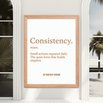 Motivational Consistency Framed Poster 12x16 hung in a bright room with palm trees, inspiring daily habits and personal growth.