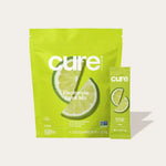 Cure Hydration Lime Electrolyte Mix front view with pouch and single-serve stick, natural hydration supplement.