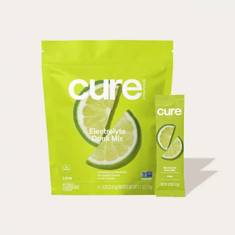 Cure Hydration Lime Electrolyte Mix front view with pouch and single-serve stick, natural hydration supplement.