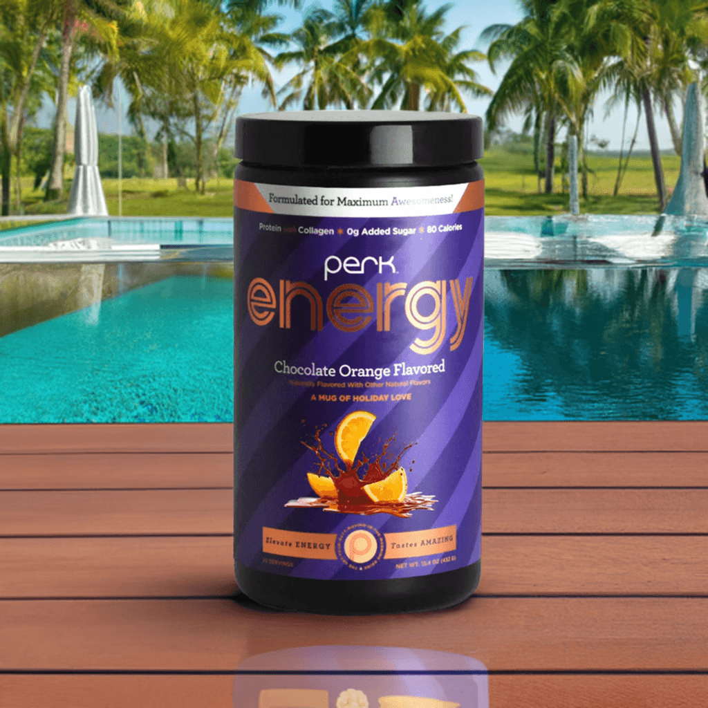 Energy Chocolate Orange-Boost Drink with caffeine and collagen, 20 servings container placed poolside for tropical energy vibes.