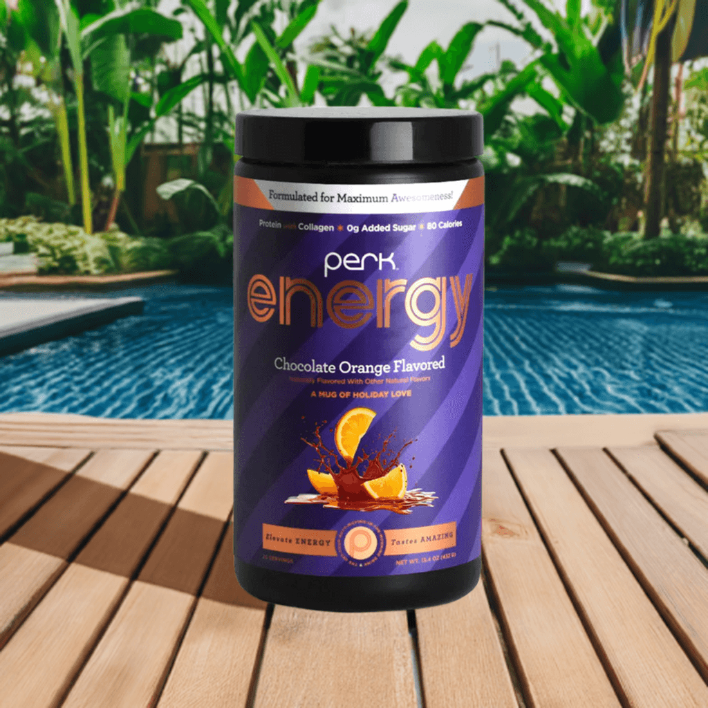 Perk Energy Chocolate Orange-Boost Drink, 20 servings, featured on a wooden deck with lush greenery and pool, promoting natural energy.
