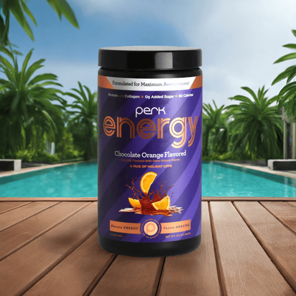 Energy Chocolate Orange-Boost Drink with caffeine and protein, 20 servings, displayed on a wooden deck near a luxury pool setting.
