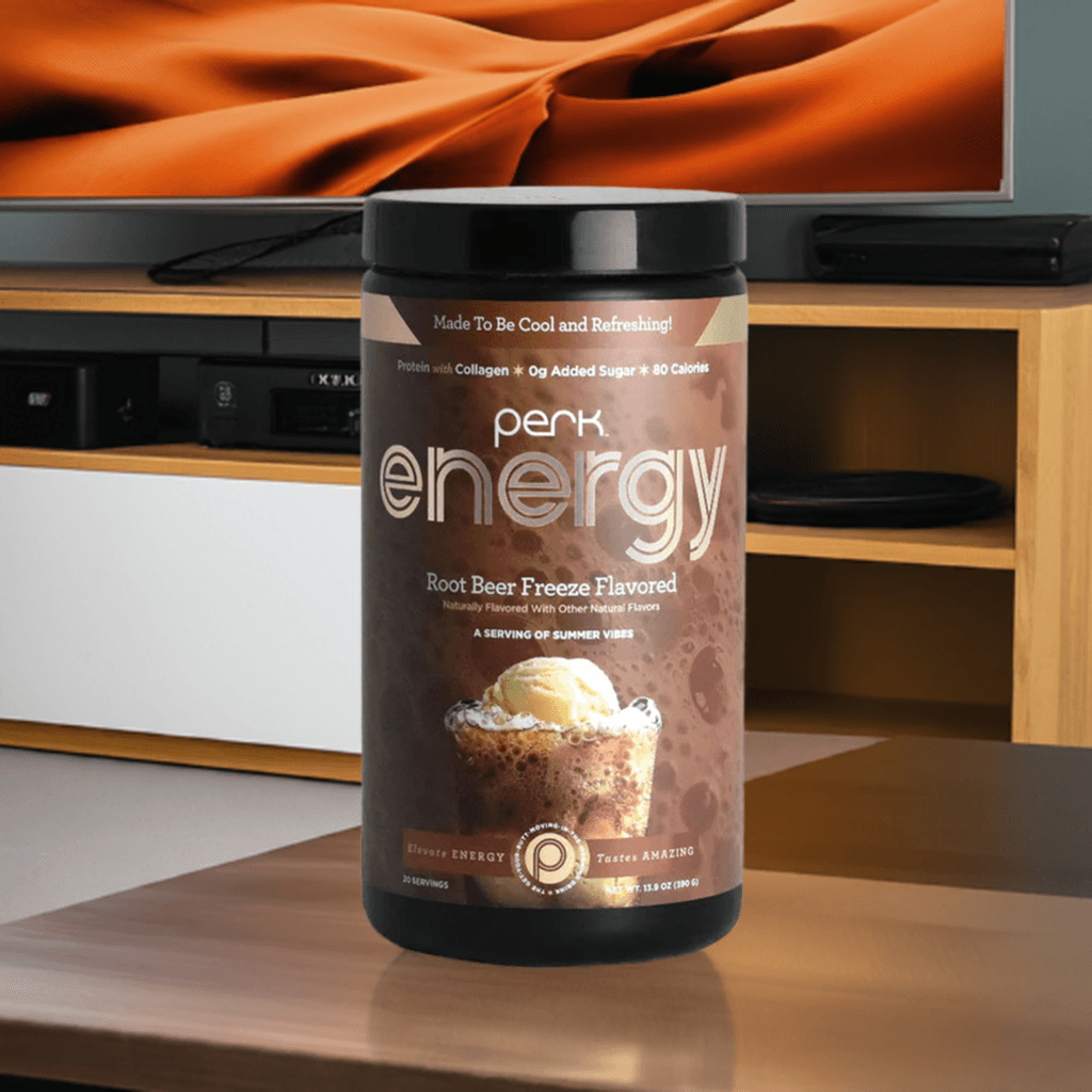 Perk Energy Root Beer Freeze Drink displayed in a cozy living room, ideal for a refreshing, protein-rich energy boost with natural caffeine.