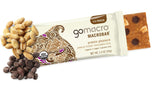 Unwrapped GoMacro Peanut Butter Chocolate Chip bar next to scattered chips and peanuts, showing texture and clean ingredients.