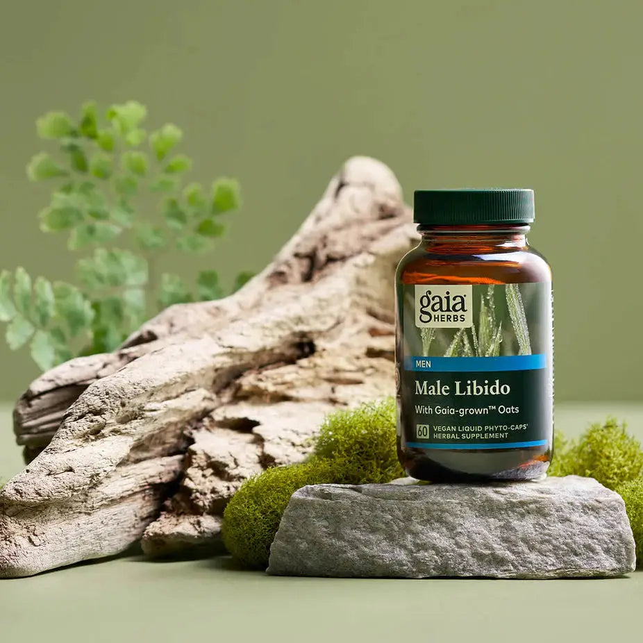 Gaia Herbs Male Libido 60 ct herbal supplement bottle displayed on stone with natural elements, promoting stamina and vitality support.