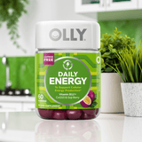 Olly Daily Energy Gummies – Tropical Passion with B12, CoQ10 & Goji Berry, 60 ct bottle placed in a modern kitchen. Natural energy boost supplement.