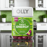Front view of Olly Daily Energy Gummies – Tropical Passion, 60 ct bottle with B12, CoQ10 & Goji Berry, placed in a stylish kitchen setting.