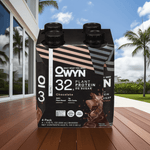 OWYN Chocolate Plant-Based Protein Shake with tropical palm trees, promoting a clean, keto-friendly lifestyle.