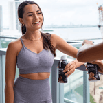 Athletic woman drinking OWYN Chocolate Pro Elite Protein Shake after workout for muscle recovery and vegan nutrition.