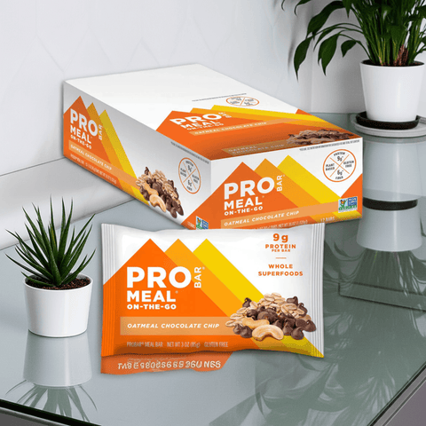 Probar Meal Bar Oatmeal Chocolate Chip box and single bar on counter, 12-pack of high-protein gluten-free vegan meal replacement bars