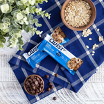 Quest Protein Bar Oatmeal Chocolate Chip Flavor Display with Cookies and Chocolate