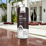 Slate Milk Dark Chocolate high-protein shake featured on stylish patio – perfect for active lifestyles.