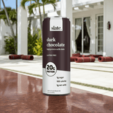 Slate Milk Dark Chocolate high-protein shake featured on stylish patio – perfect for active lifestyles.