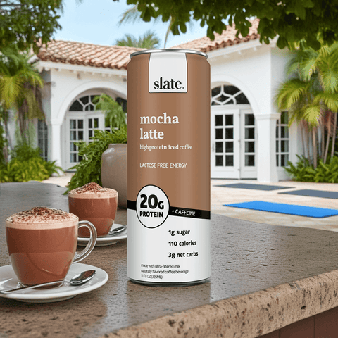 Slate Milk Classic Chocolate Shake can placed poolside, promoting a refreshing high-protein, lactose-free lifestyle.