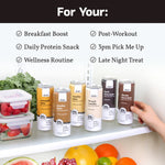 Hand displaying full lineup of Slate Milk protein shakes including Classic Chocolate, ideal for low sugar, high protein lifestyles.