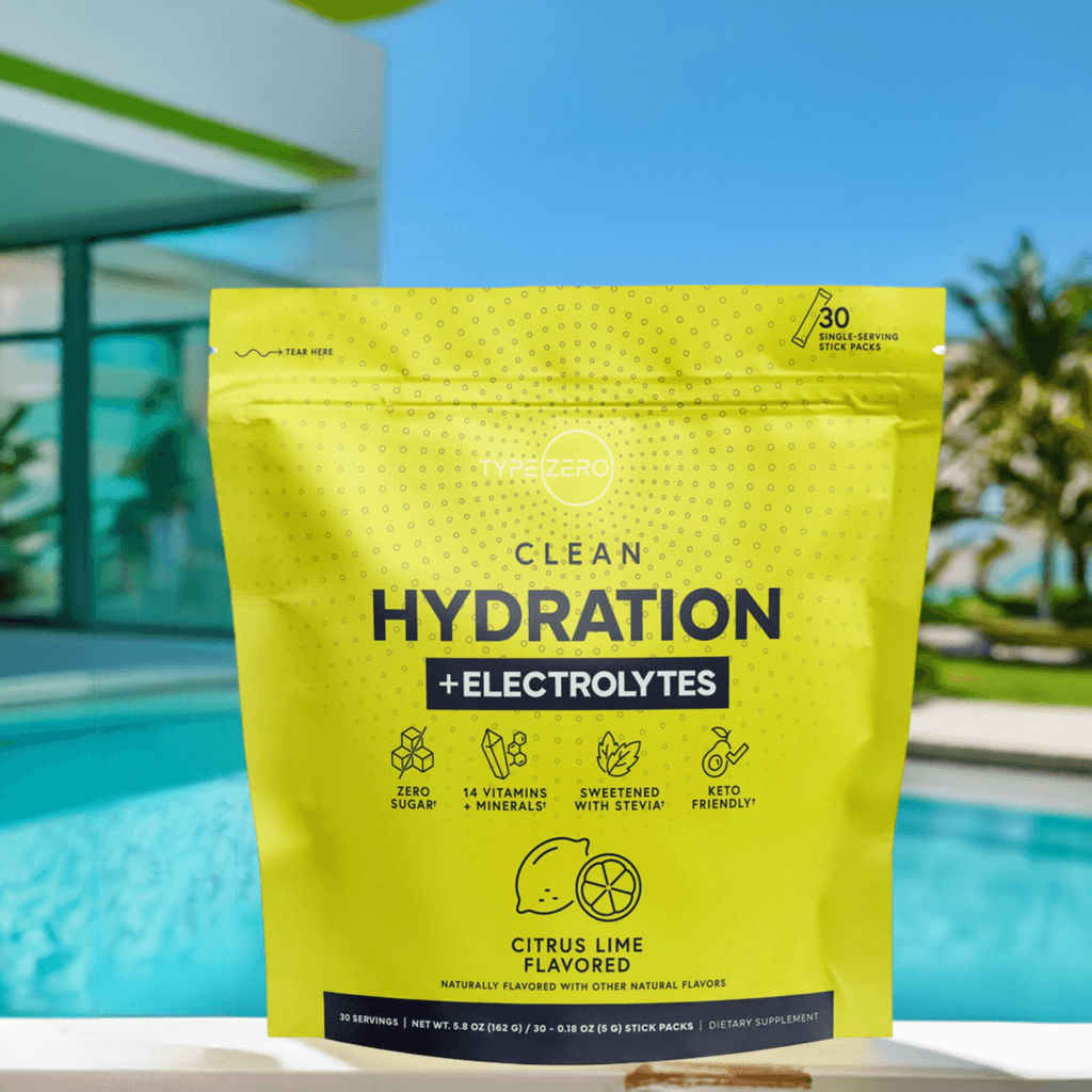 Citrus Lime Hydration + Electrolytes pouch beside a bright blue pool and modern architecture, promoting active hydration in warm weather.