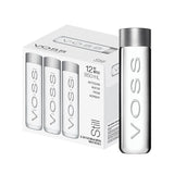 VOSS Still Water 850ml glass bottles in a retail box set of 12, showcasing premium minimalist packaging design.
