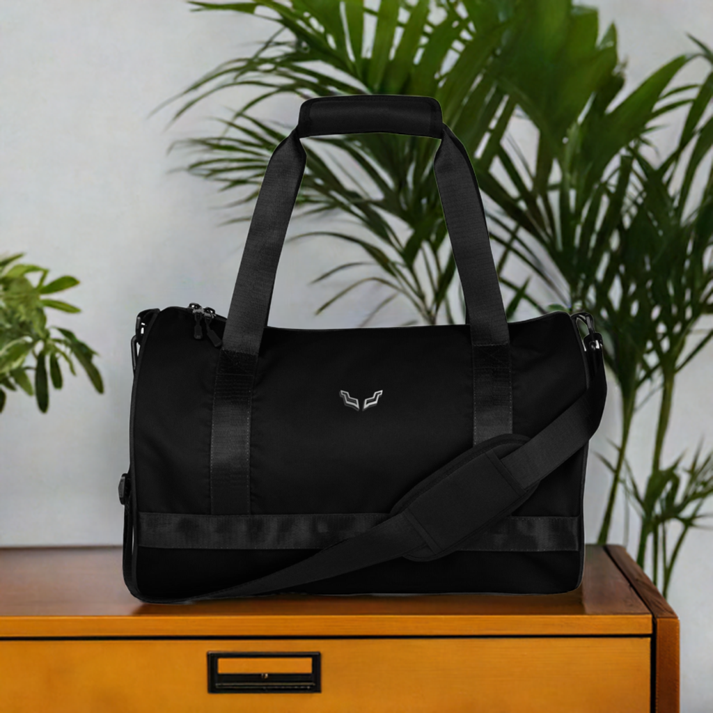 Velite Armor Gym Bag in sleek black polyester with water-resistant finish, featuring dual handles and adjustable shoulder strap for active lifestyles.