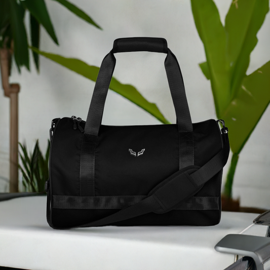 Velite Armor Gym Bag in sleek black polyester with shoulder strap, ideal for workouts and travel. Stylish, water-resistant fitness accessory.