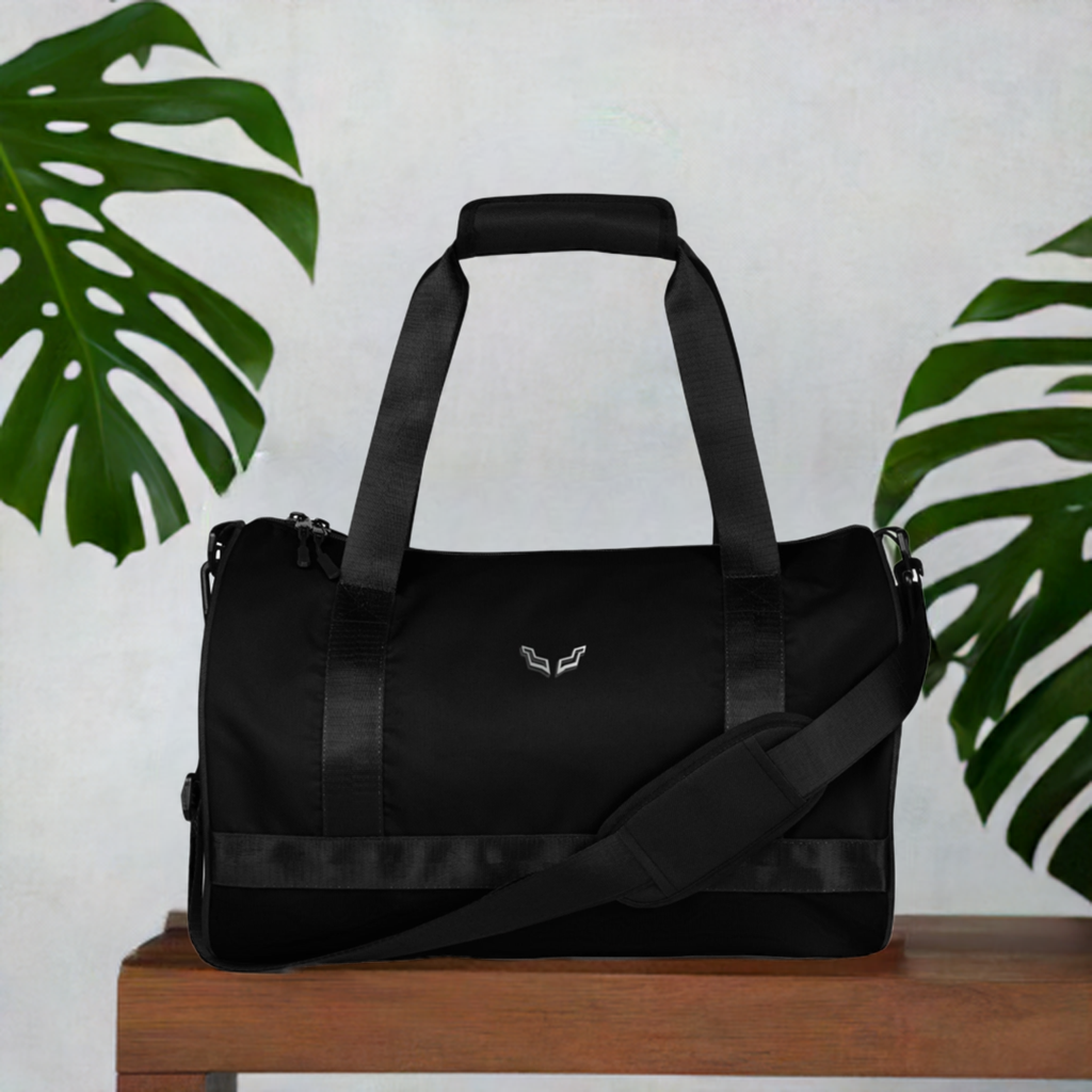 Velite Armor Gym Bag in sleek black design with shoulder strap and dual handles, ideal for active lifestyles and stylish fitness travel.