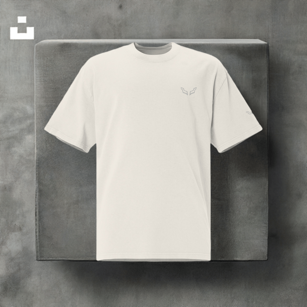 Velite Armor Oversized Embroidered Tee – Premium Heavyweight in off-white displayed on gray block, featuring minimalist embroidered logo.