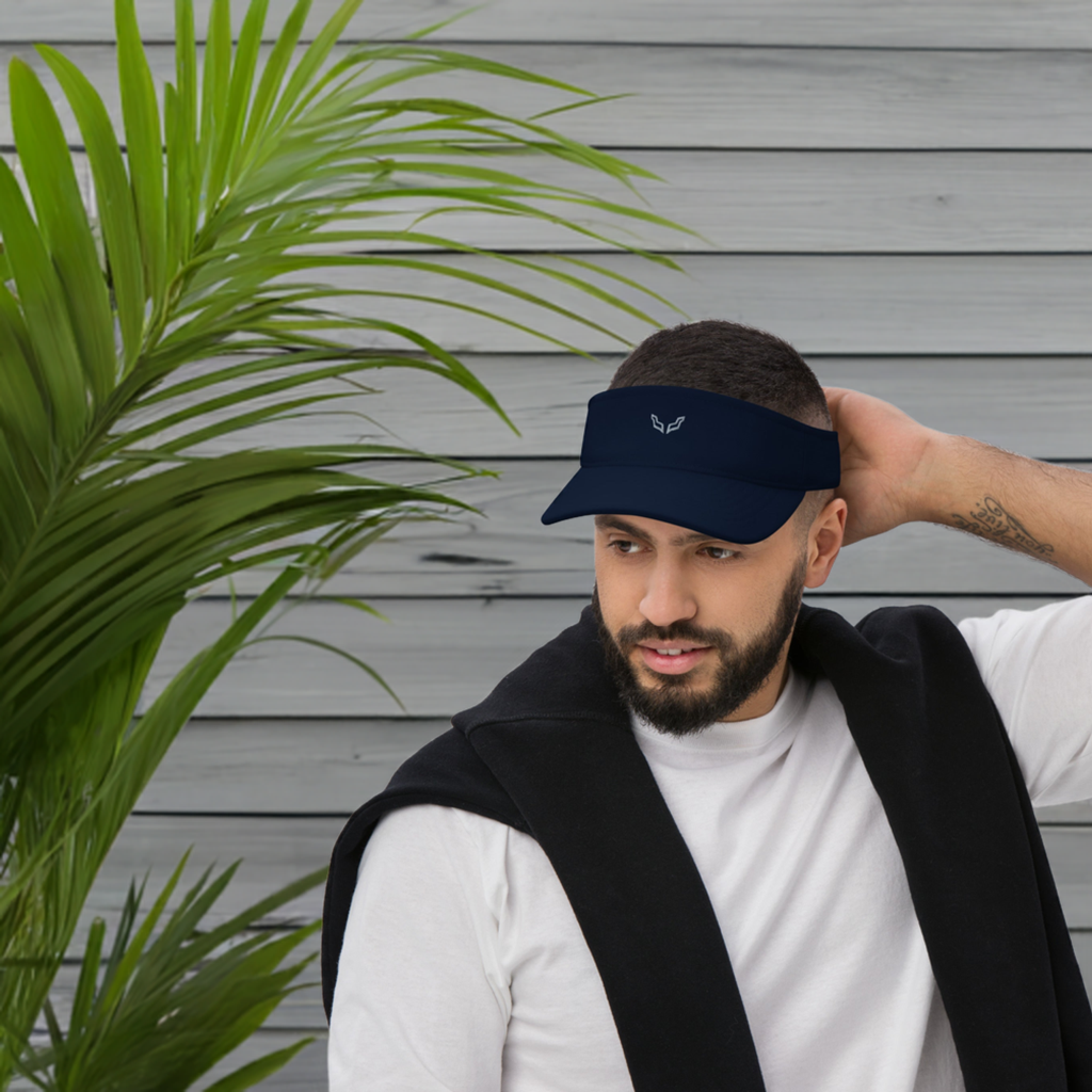 Velite Armor Performance Visor - Lightweight Style & Functionality in navy blue worn by a man, showcasing its low-profile, unisex design for active lifestyles.