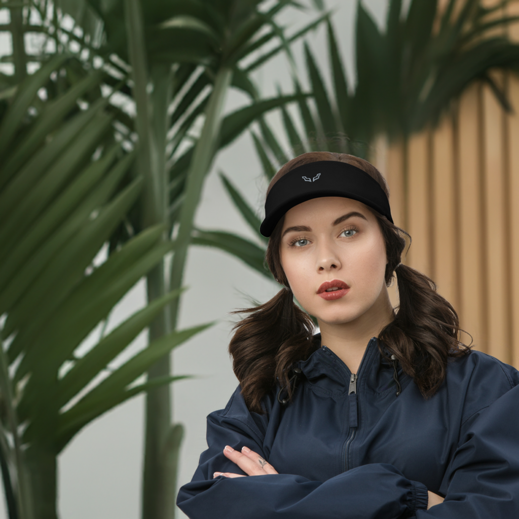 Velite Armor Performance Visor - Lightweight Style & Functionality worn by a woman with pigtails, styled with a navy windbreaker. Ideal for active and casual wear.