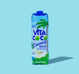Vita Coco Original Coconut Water 1L Tetra Pak with blue cap on light blue background, pure natural hydration beverage.
