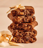Close-up view of Aloha Coconut Chocolate Almond Protein Bars stacked, showing texture with real coconut flakes and chocolate chunks.