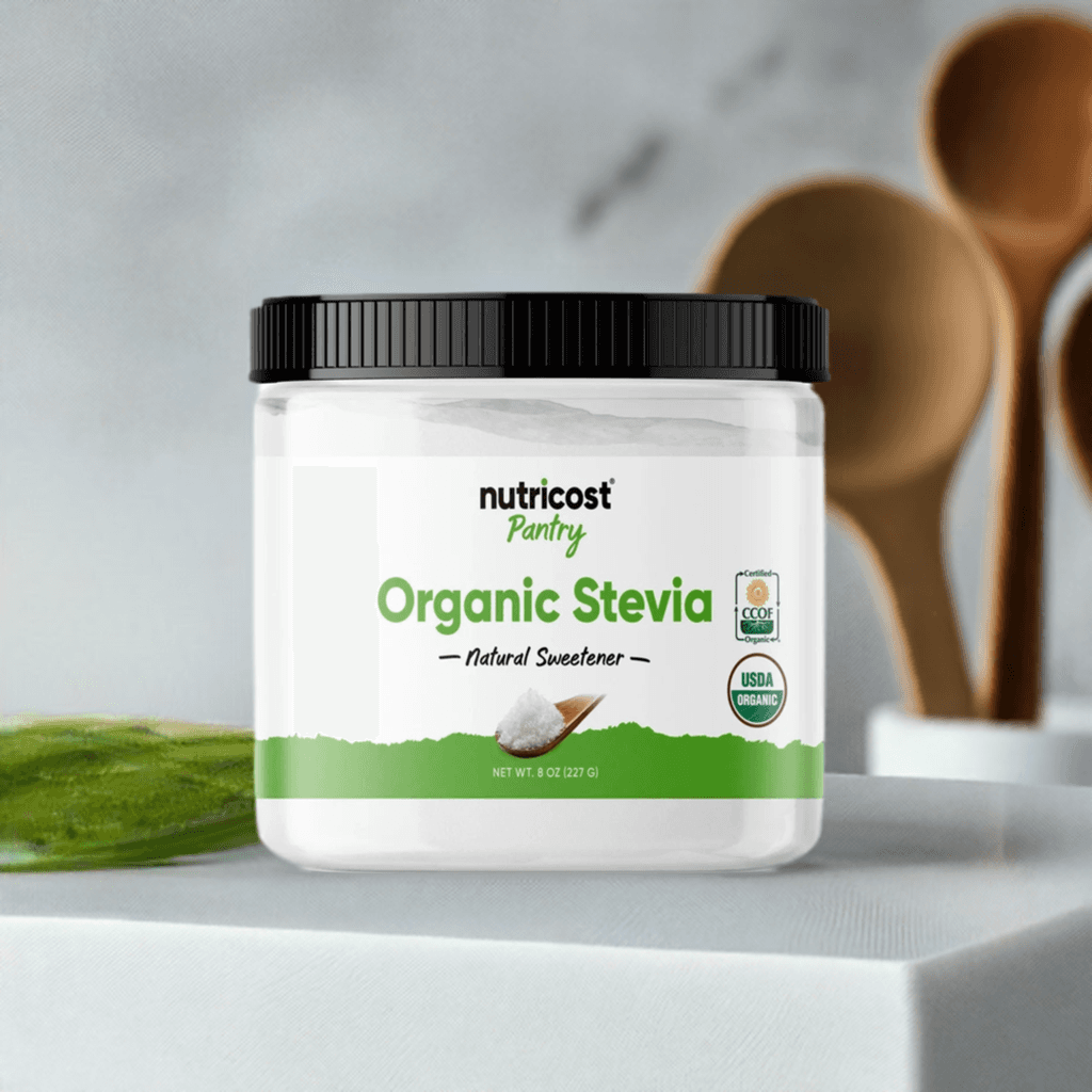 Nutricost Pantry Organic Stevia Powder 8oz jar on kitchen counter with wooden utensils, a pure natural sweetener for healthy recipes and drinks.