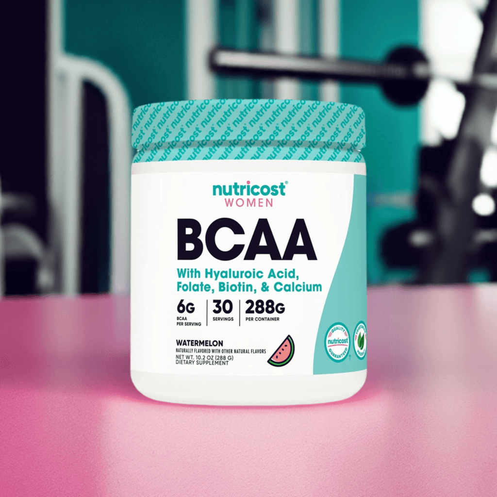 Nutricost BCAA for Women watermelon flavor supplement jar on gym bench, designed to boost muscle growth and recovery with 6g BCAAs per serving.