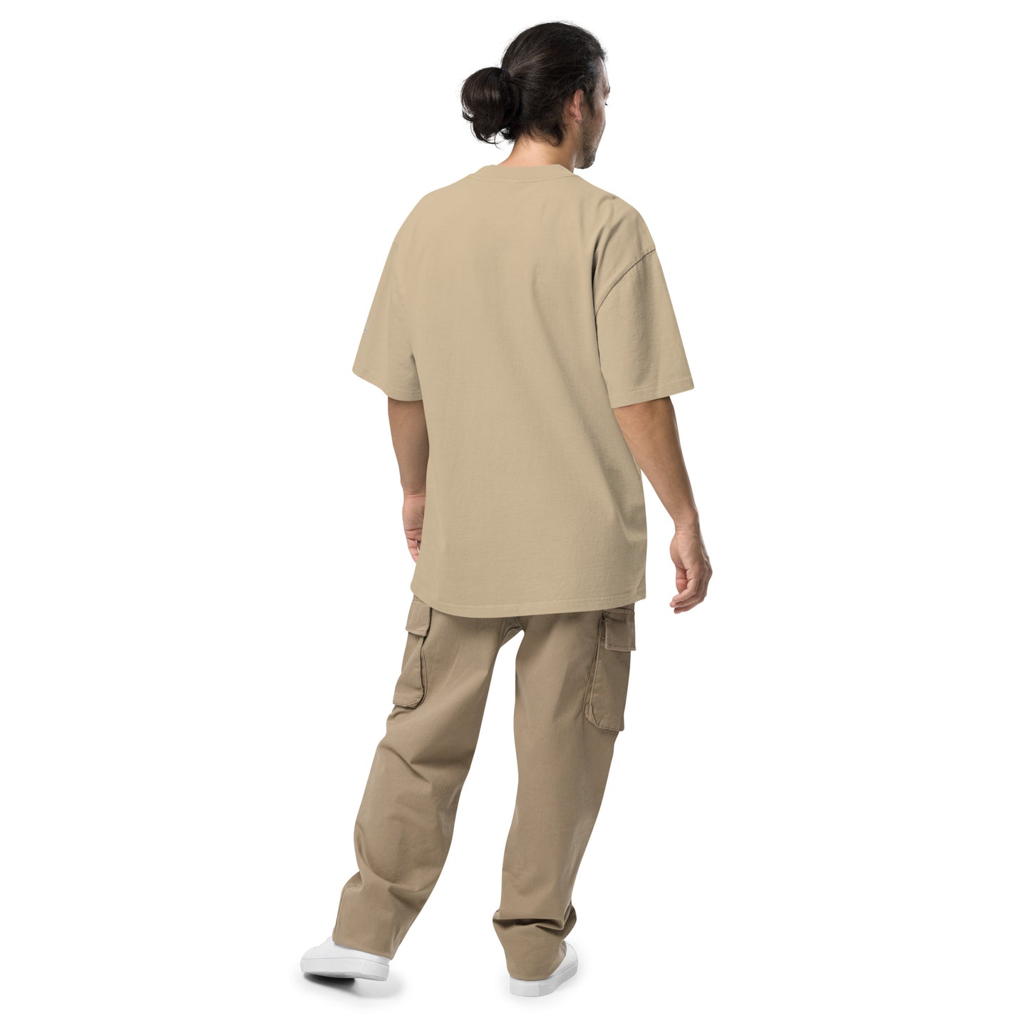 Model showing back of Velite Armor Oversized Embroidered Tee – Premium Heavyweight in beige, paired with cargo pants and sneakers.