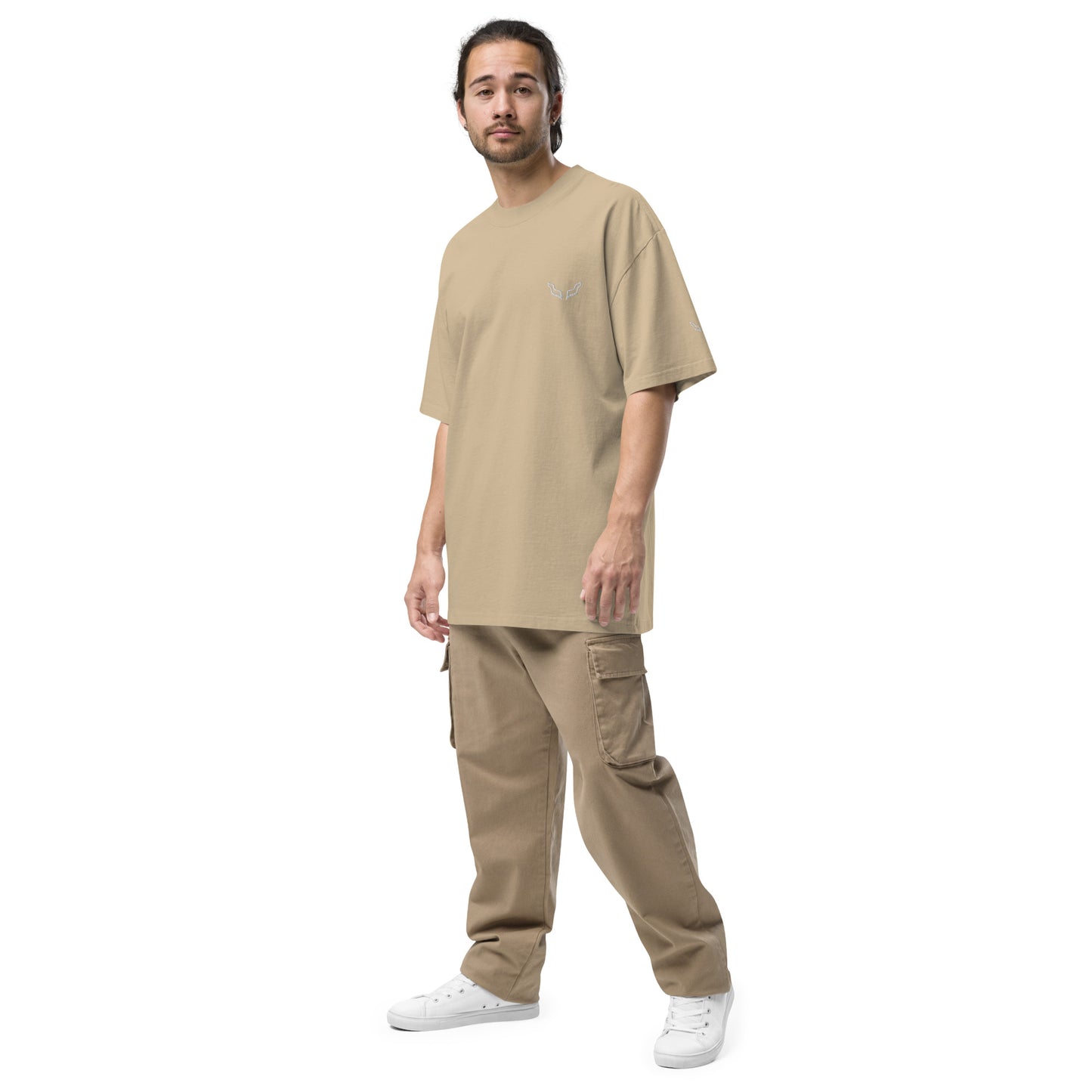 Model wearing Velite Armor Oversized Embroidered Tee – Premium Heavyweight in beige, styled with tan cargo pants and white sneakers.