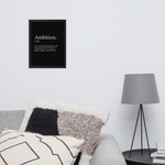 Modern bedroom interior with framed "Ambition" definition poster on white wall above the bed.