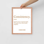 Hand holding the Consistency Framed Poster 12x16, showcasing minimalist motivational wall art perfect for home gym or office decor.