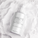 Velite Essentials Lotion - Vegan Hand Body Care bottle on creamy lotion background, highlighting its hydrating formula and texture.