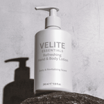 Velite Essentials Lotion - Vegan Hand Body Care bottle on stone with shadow, highlighting its clean, minimalist packaging design.
